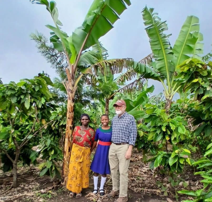 Jesca Nsmire and her Mom show their banana and coffee plantation to Doug Lockwood.